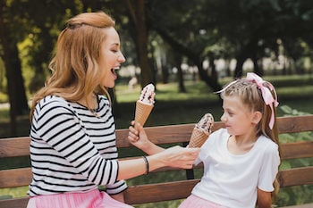 Mother and daughter eating ice cream